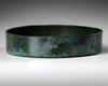 AN ACHAEMENID BRONZE LOTUS BOWL, EARLY 5TH CENTURY B.C.