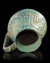 A TURQUOISE GLAZED POTTERY EWER, PROBABLY NISHAPUR, 12TH CENTURY