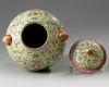 A Chinese yellow-ground famille rose 'Eight Immortals' vase and cover