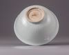 A Chinese Shufu-style white-glazed moulded 'dragon' bowl