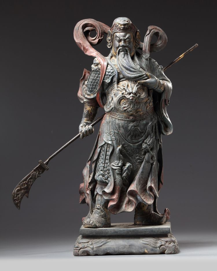 A large gilt and polychrome decorated bronze figure of Guandi