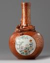 A Chinese coral-ground famille rose 'qilin' vase
