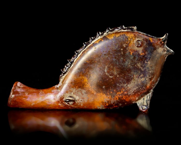 A ROMAN GLASS FLASK IN THE FORM OF A FISH, CIRCA 3RD CENTURY A.D.