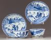 two cups and saucers decorated with multi-levels pavilions in a landscape