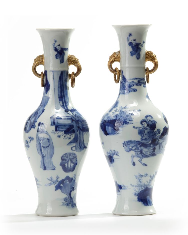 A matched pair of Chinese blue and white twin-handled slender vases