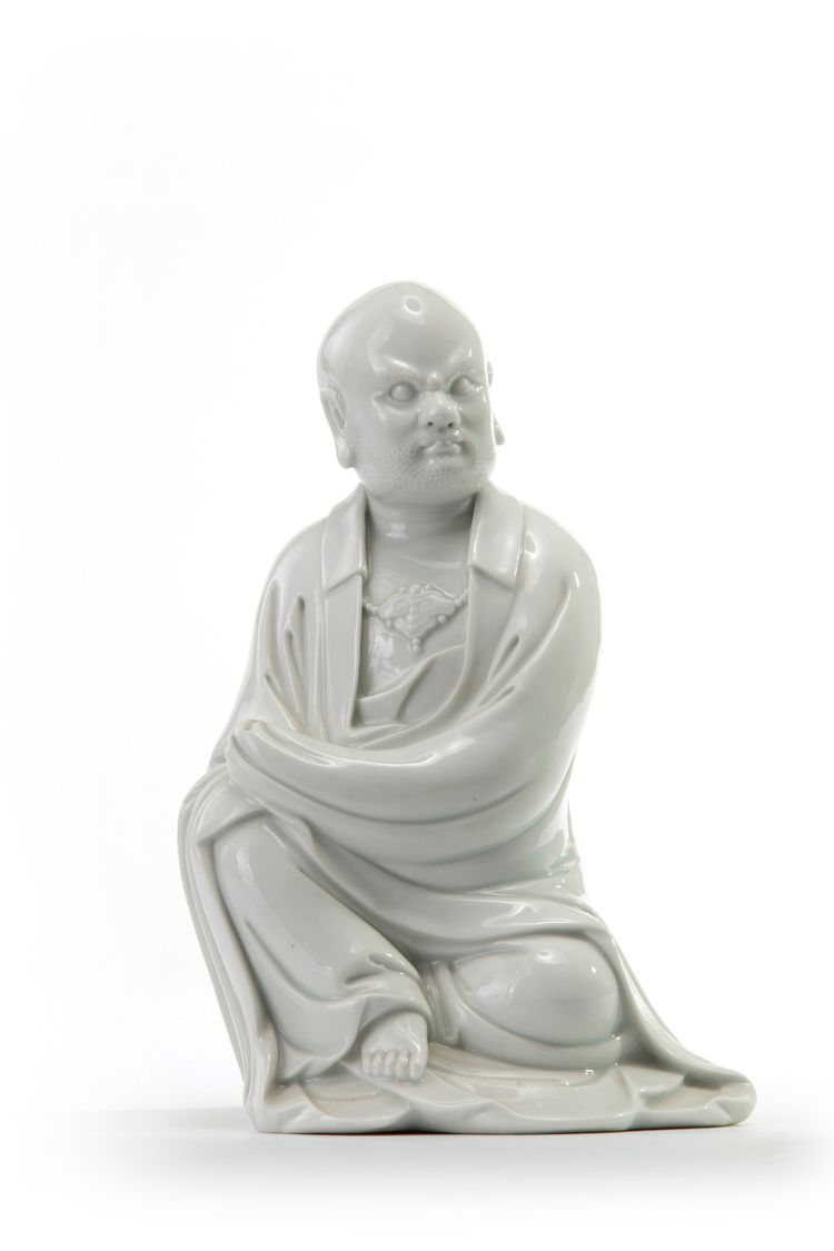 A Chinese Dehua figure of a seated Luohan