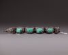 A silver filigree bracelet with Turquoise inlay
