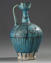 A LARGE RAQQA UNDERGLAZE PAINTED POTTERY EWER, SYRIA, 12TH-13TH CENTURY