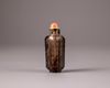 A Chinese smokey-quartz hexagonal inscribed snuff bottle