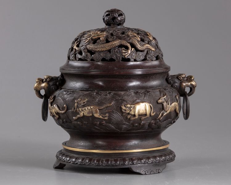 A Chinese parcel-gilt bronze 'sea creatures' censer, cover, and stand