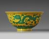 A CHINESE YELLOW-GROUND GREEN-ENAMELLED DRAGON' BOWL, QIANLONG SEAL MARK IN UNDERGLAZE BLUE AND OF THE PERIOD 1736-1795