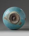 An Islamic turquoise glazed bottle vase