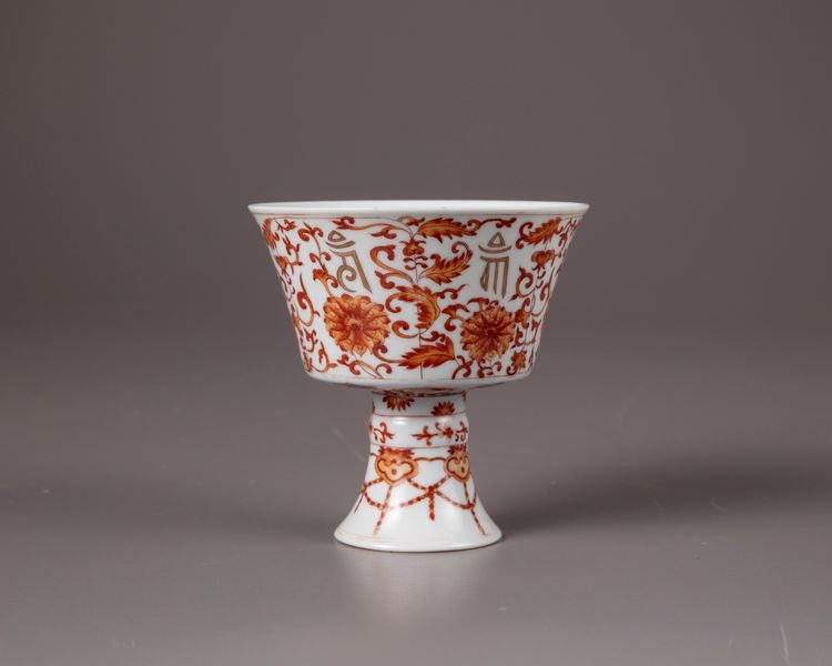 An iron-red 'lanca character' stem cup