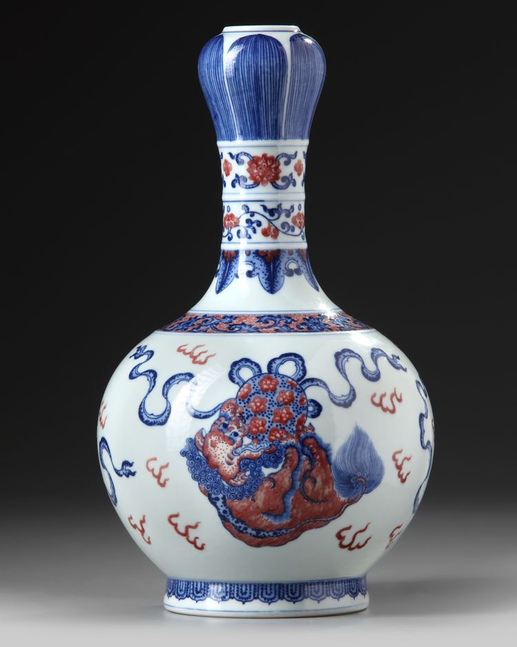 A Chinese copper-red-decorated blue and white garlic-head vase