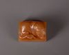 A Chinese yellow soapstone 'tiger' seal