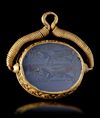 AN ACHAEMENID BLUE CHALCEDONY SEAL IN GOLD MOUNT, 5TH CENTURY BC