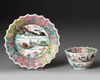 a CHINESE FAMILLE ROSE CHRYSANTHEMUM-FORM CUP AND SAUCER, EARLY QIANLONG PERIOD (1735-1795)