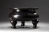 A large Chinese bronze tripod censer
