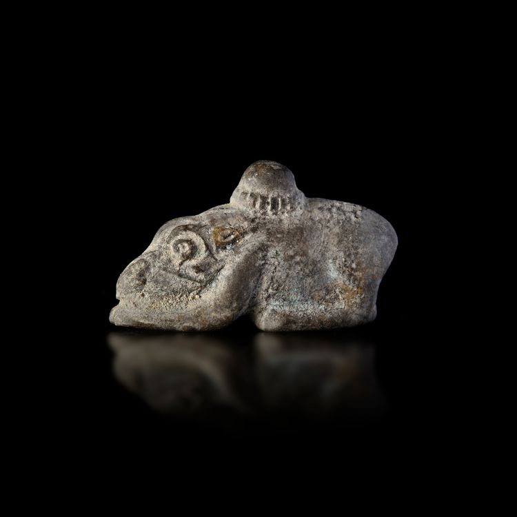 A BRONZE WEIGHT IN THE FORM OF A CROUCHING RABBIT. ACHAEMENID 5th.c.B.C.