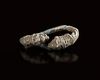 A ROMAN SILVER RING WITH LION-HEAD TERMINALS