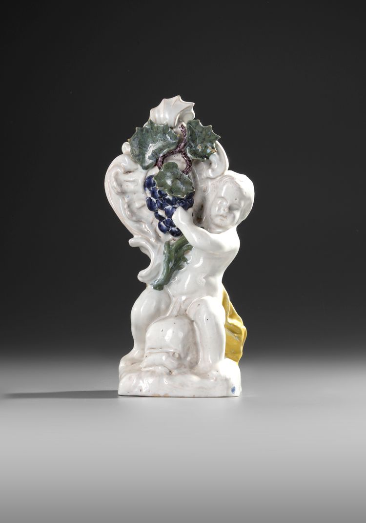 A  SCHREZHEIM FAIENCE STATUETTE 'ALLEGORY OF AUTUMN', 18TH CENTURY