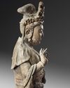 A LARGE CHINESE POLYCHROME-DECORATED WOOD CARVING OF GUANYIN, POSSIBLY SONG-YUAN DYNASTY