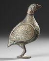 A PERSIAN SILVER INLAID BRONZE BIRD, KHURASSAN STYLE, 19TH-20TH CENTURY