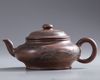 A Chinese Yixing 'landscape' teapot and cover