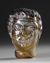 A ROMAN GLASS HEAD VESSEL CIRCA 1ST–3RD CENTURY A.D.
