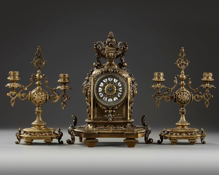 A NEO-RENAISSANCE STYLE BRONZE CLOCK AND CANDLELABRA SET, LATE 19TH CENTURY