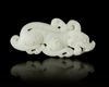 A CHINESE WHITE JADE BUDDHIST LION PENDANT, 20TH CENTURY