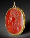 A ROMAN CARNELIAN INTAGLIO WITH THE BUST OF APOLLO, CIRCA 1ST CENTURY B.C. / A.D.