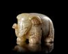A PALE CELADON JADE ELEPHANT, CHINA, HAN DYNASTY (206 BC–220 AD)