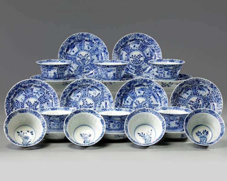 Ten sets of Chinese blue and white foliate rimmed cups and saucers