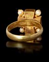 A BYZANTINE GOLD RING WITH A GARNET INLAY, 5TH-6TH CENTURY AD