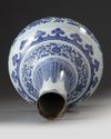 A CHINESE MING-STYLE BLUE AND WHITE BOTTLE VASE