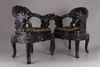 A pair of Chinese hardwood dragon chairs