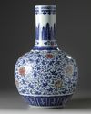 A Chinese blue and white and underglaze copper red-decorated ‘flower scroll’ bottle vase