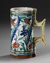 AN OTTOMAN IZNIK POTTERY TANKARD, TURKEY 17TH CENTURY