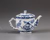 A small Chinese blue and white teapot and cover