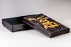 A Chinese carved and gilt zitan box and cover