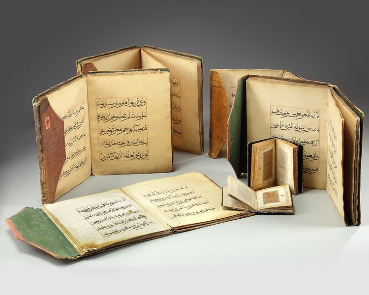 A GROUP OF FIVE CHINESE QURANS AND TWO KASHMIR QURANS