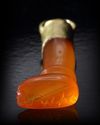 A CARNELIAN AMULET/SEAL IN THE SHAPE OF A LEG, CIRCA 700 BC