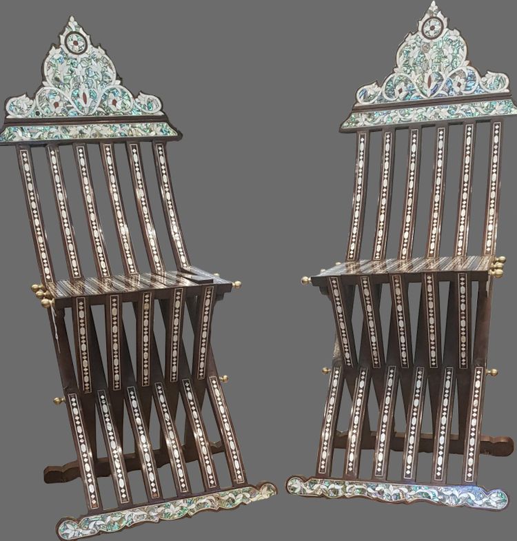Two wooden mother of pearl inlaid chairs