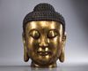 A large Chinese gilt bronze buddha head