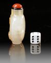 A CHINESE SHADOW AGATE 'BUDDHIST LION' SNUFF BOTTLE