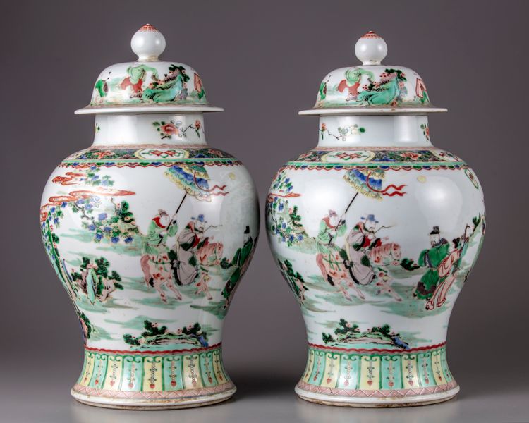 A pair of famille verte vases with cover