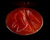 A ROMAN INTAGLIO IN CARNELIAN OF AN EAGLE FIGHTING A SNAKE, 2ND CENTURY AD