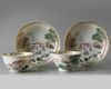 A pair of Chinese famille rose 'harbour' cups and saucers