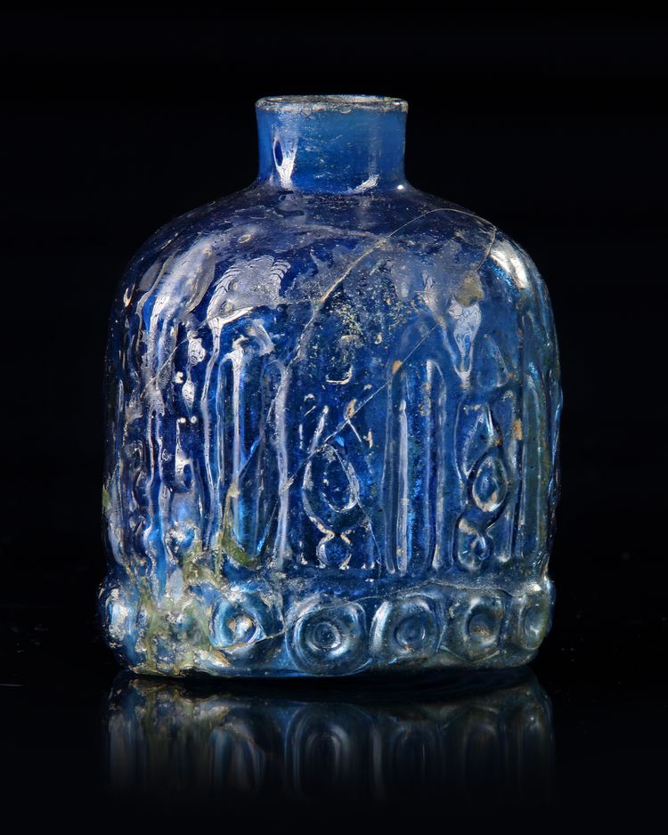 A BLUE GLASS BOTTLE, PERSIA, 12TH CENTURY